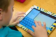 Kindergartners at Explore Knowledge Academy use Apple iPads during class to enhance their learning experience. Thursday Feb. 16, 2012.